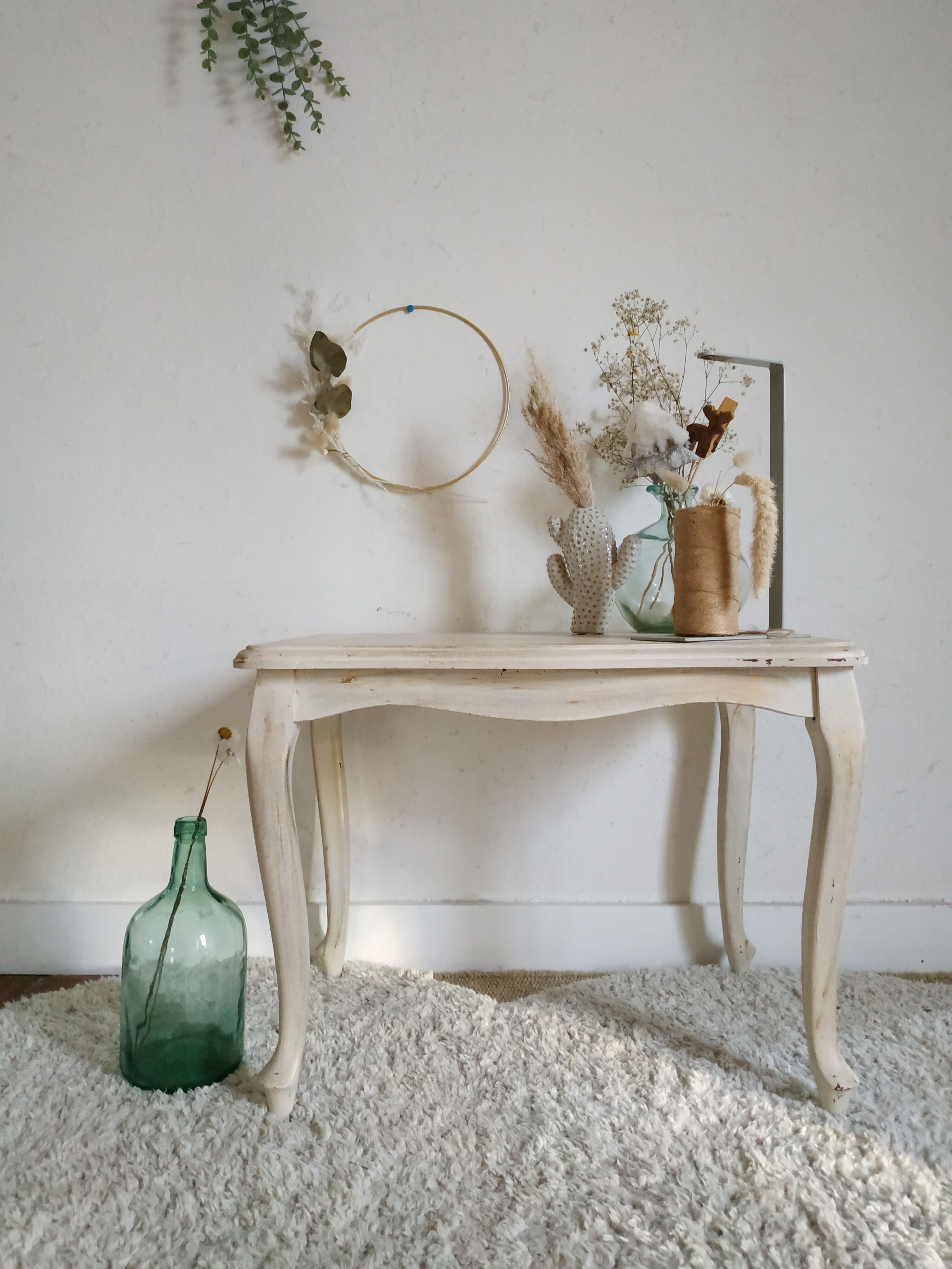 Old patinated coffee table and curved feet