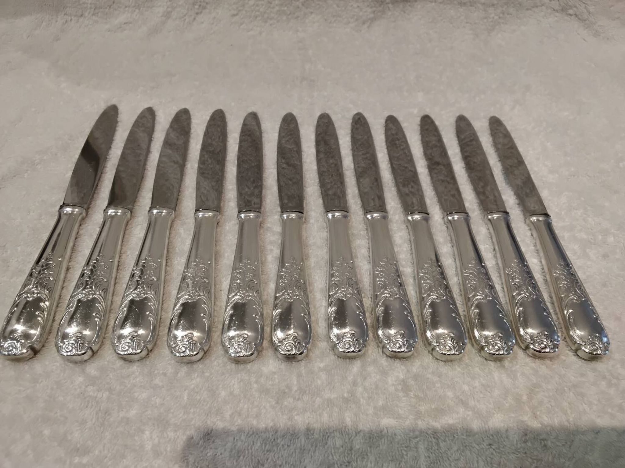 12 silver-plated dessert knives by Platil, rocaille style