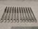 12 silver-plated dessert knives by Platil, rocaille style