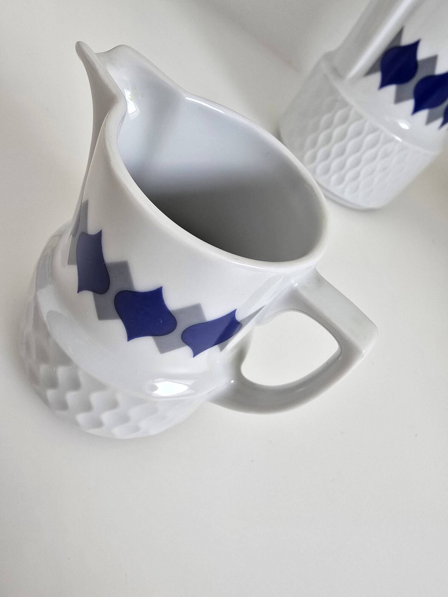 Vintage Schirnding Bavaria coffee pot and milk jug, blue geometric pattern.