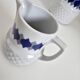 Vintage Schirnding Bavaria coffee pot and milk jug, blue geometric pattern.
