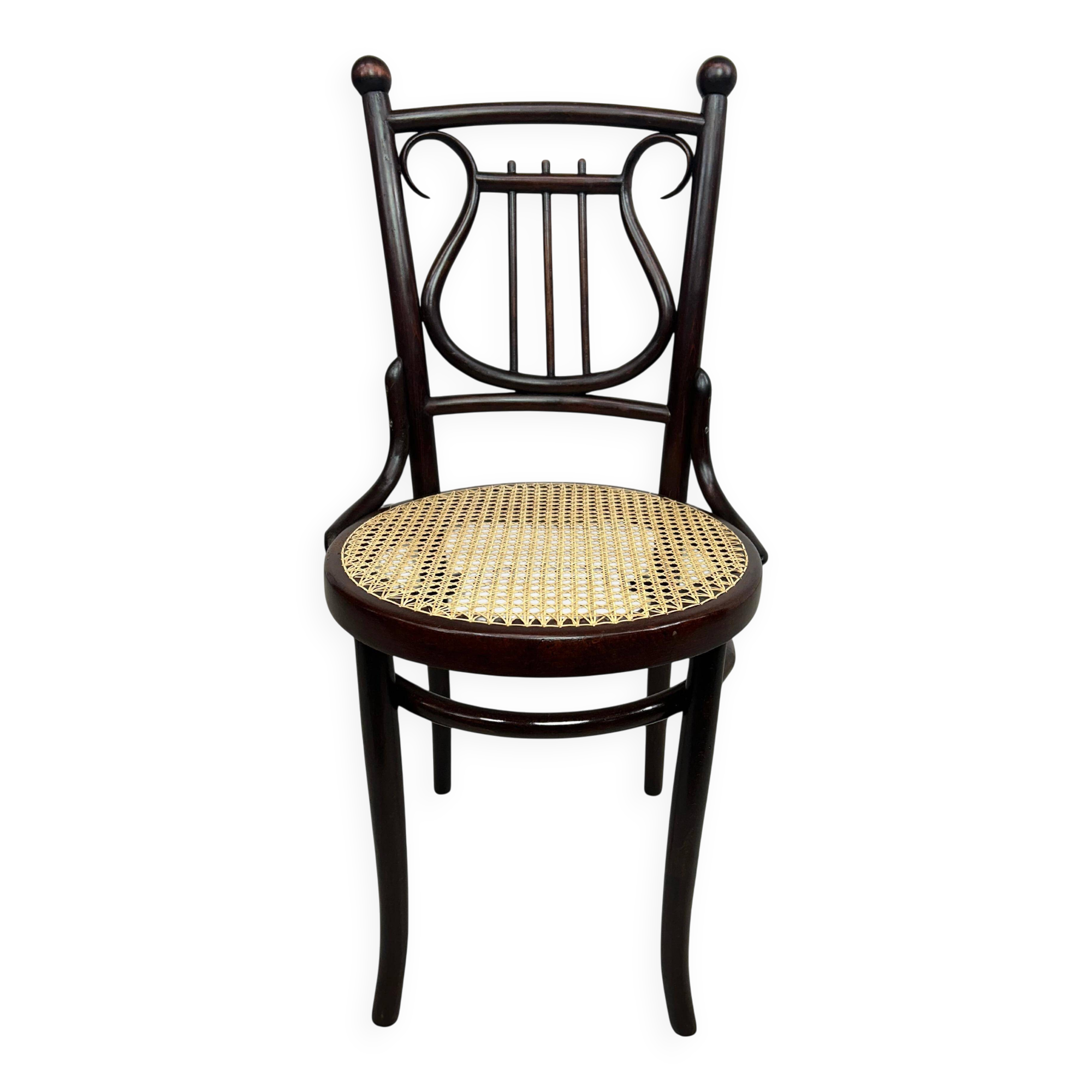 Curved wooden chair attributed to Thonet.