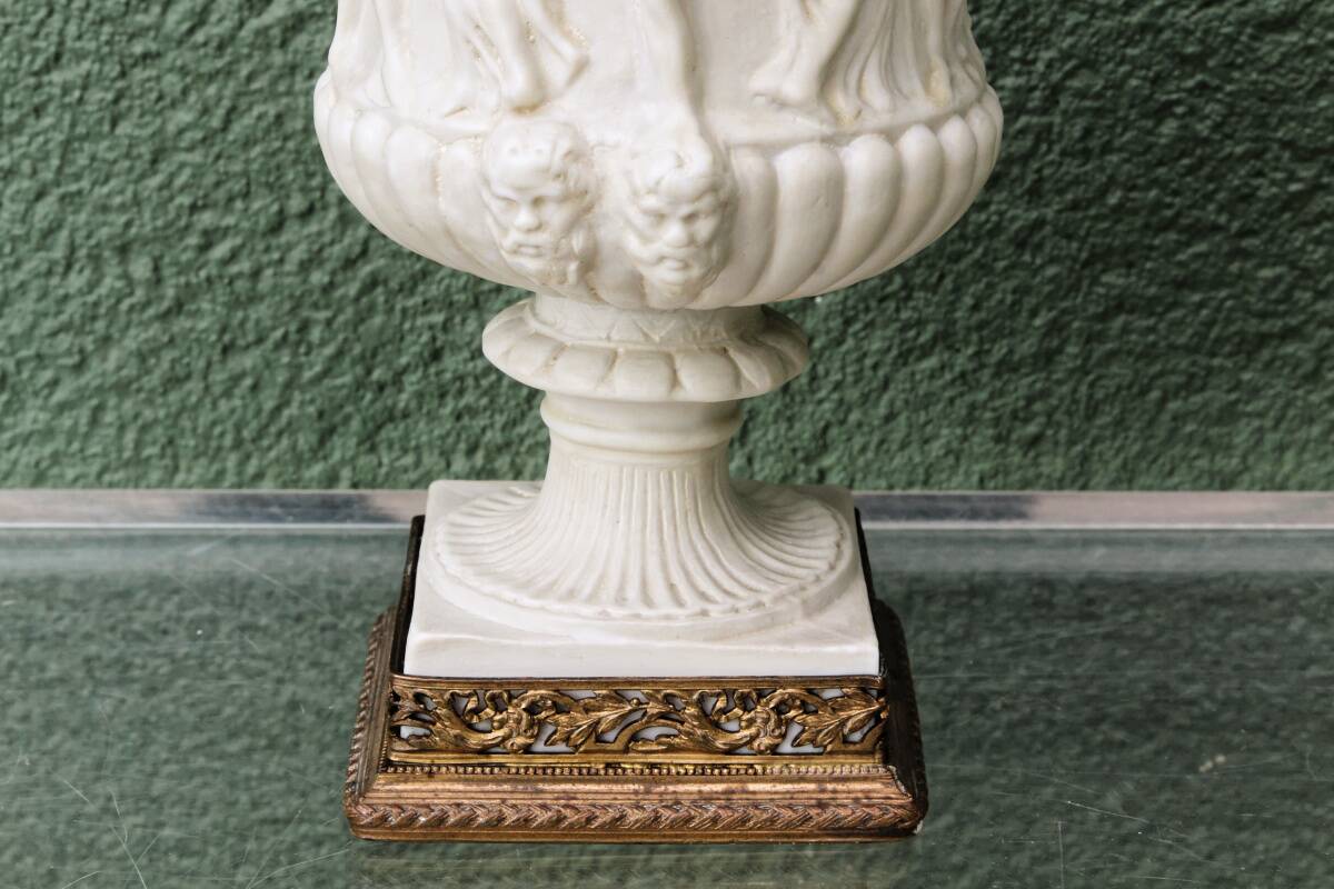 Pair of Medicis Borghese vases in porcelain biscuit and brass.