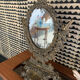 Psyche mirror in brass