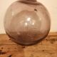 Old glass ball of fishing net marked "LT"