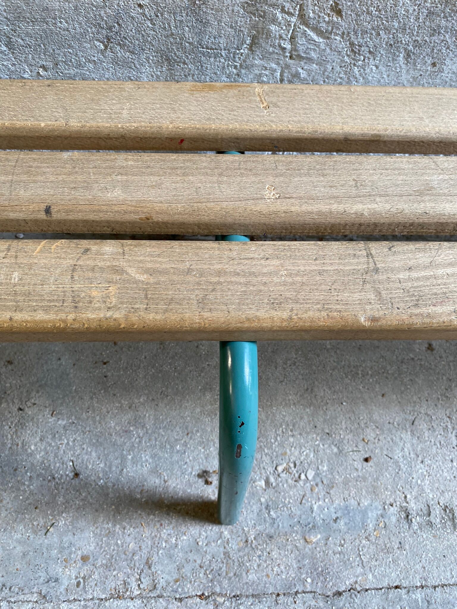 Vintage wood kindergarten bench and tubular structure in long