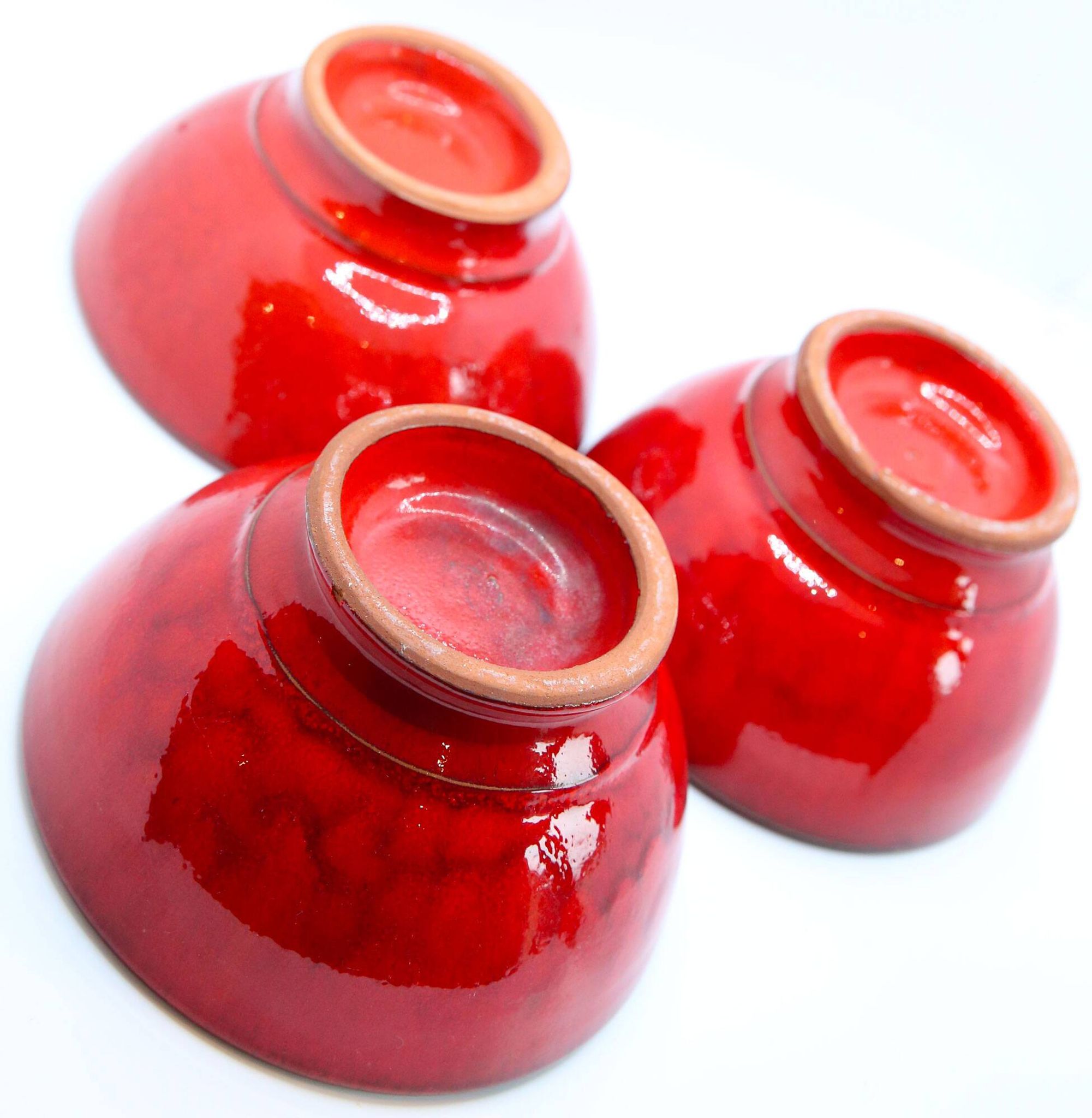 Set of 3 bright red enamelled earth bowls made in France
