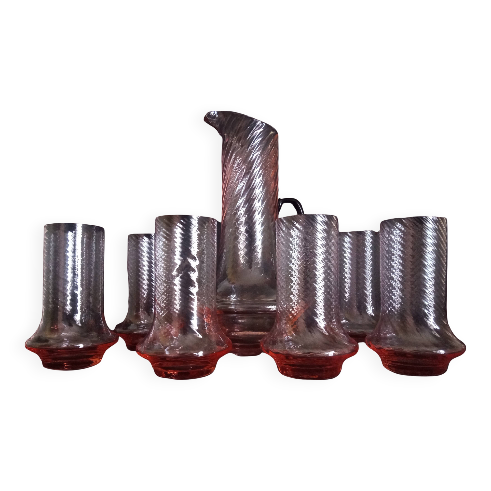 Art Deco orangeade service in pink-orange glass, twisted model.