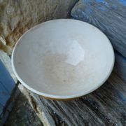 Old yellow ceramic coffee bowl with white polka dots