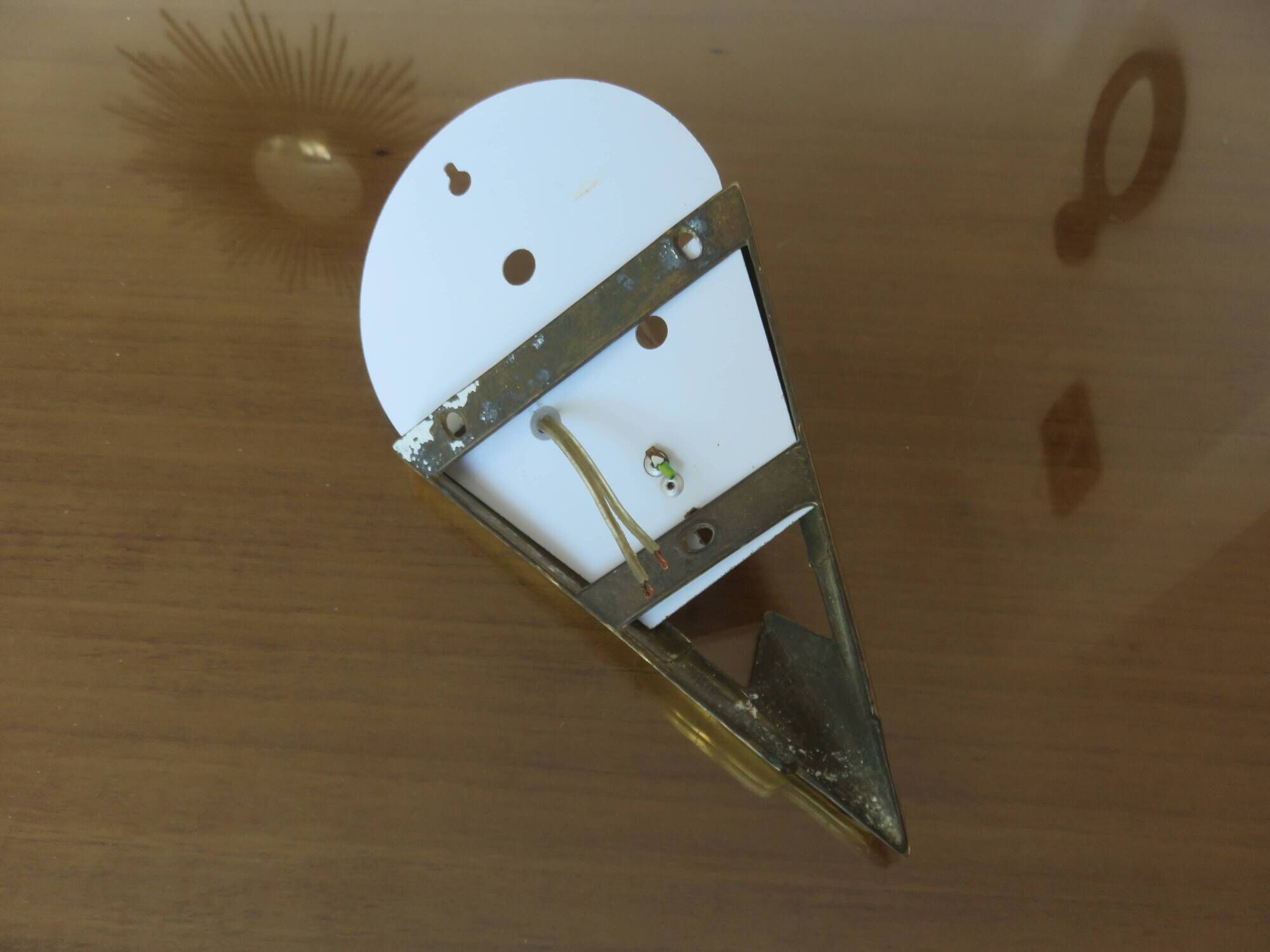 Art Deco wall light in brass and thick frosted glass.