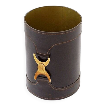 Brown leather wastepaper basket with decorative gold metal buckle.