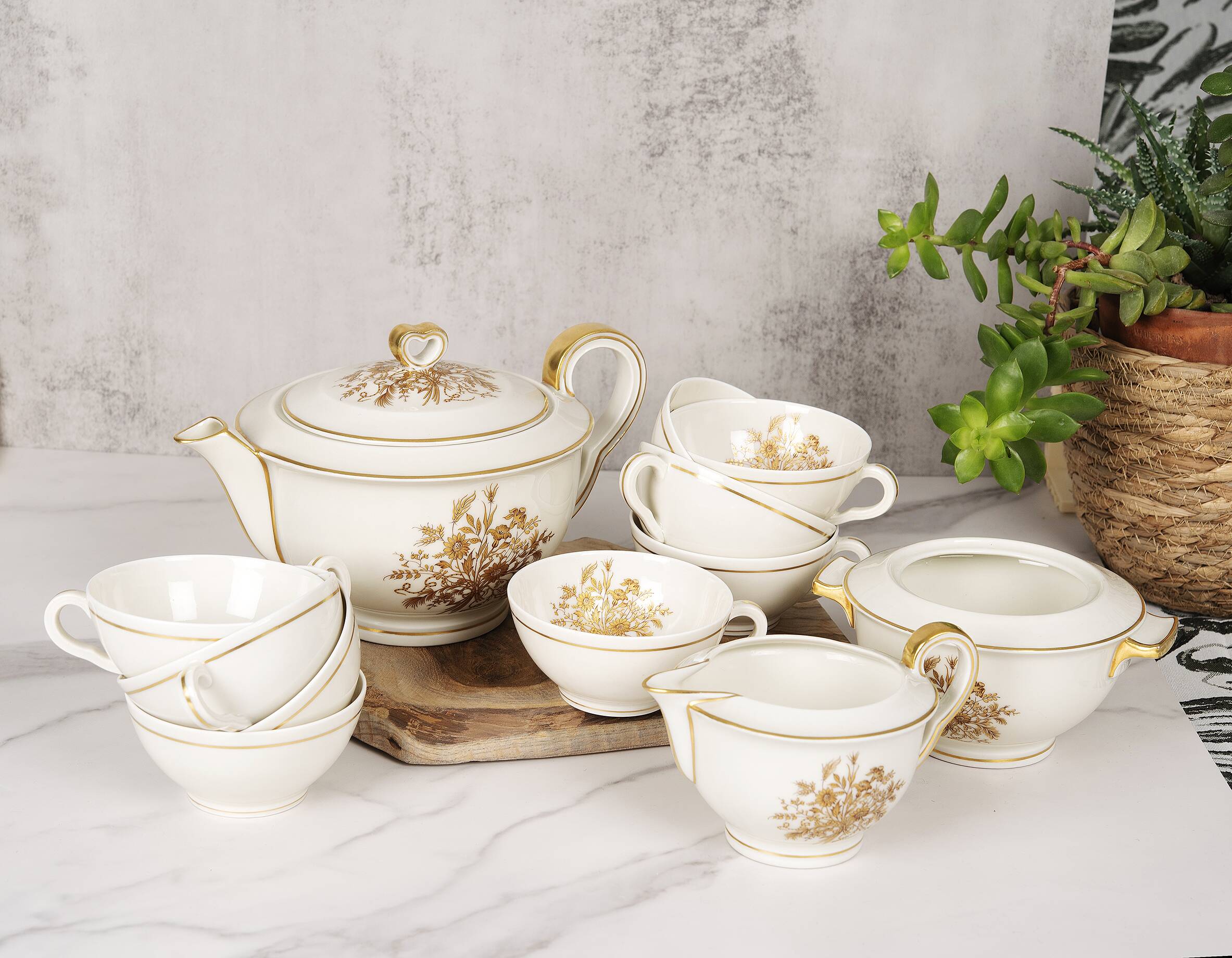 Porcelain tea service by Théodore Haviland, gilded patterns.