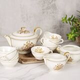 Porcelain tea service by Théodore Haviland, gilded patterns.