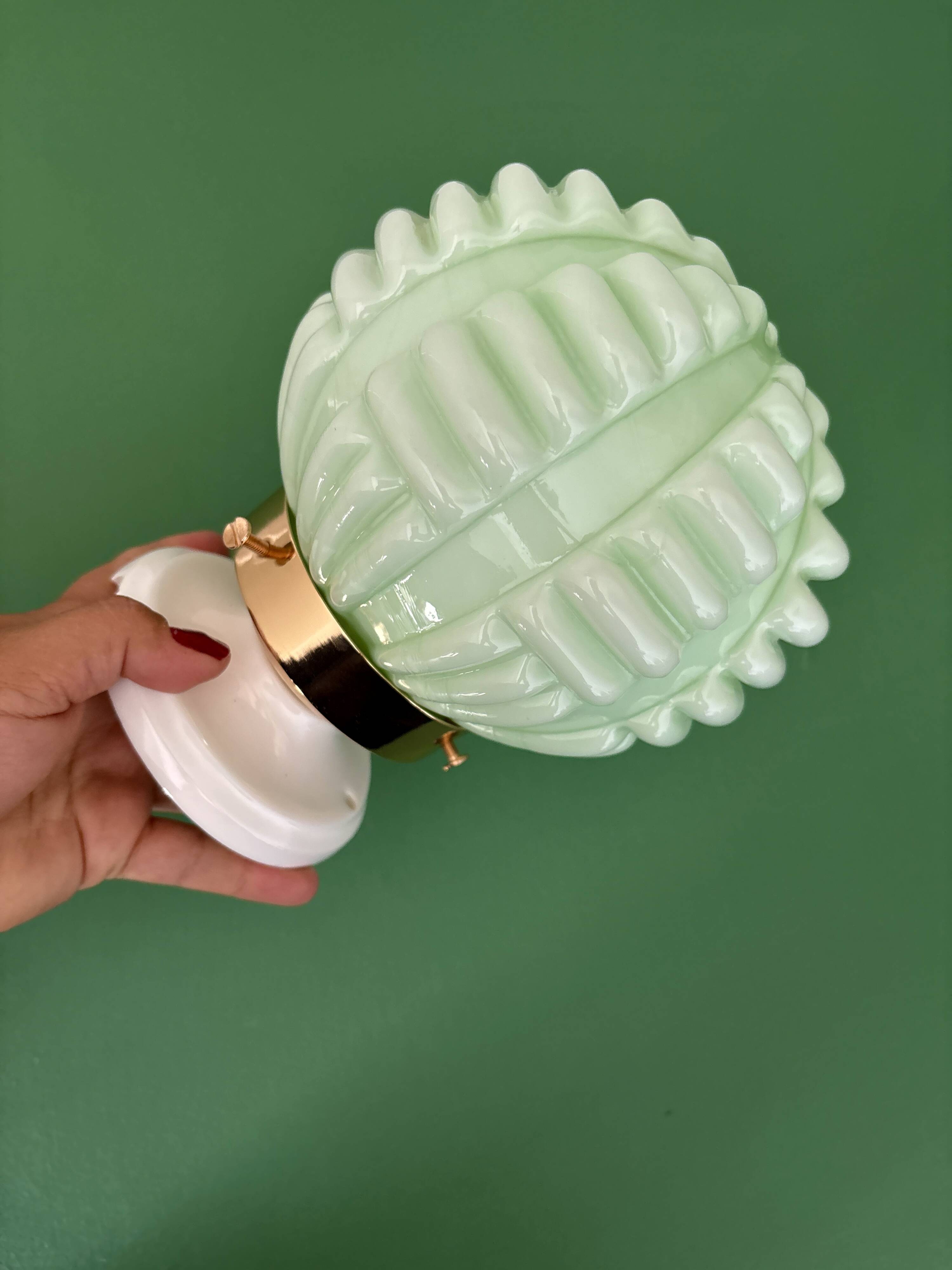 Vintage Art Deco globe wall light in pale green opaline.
