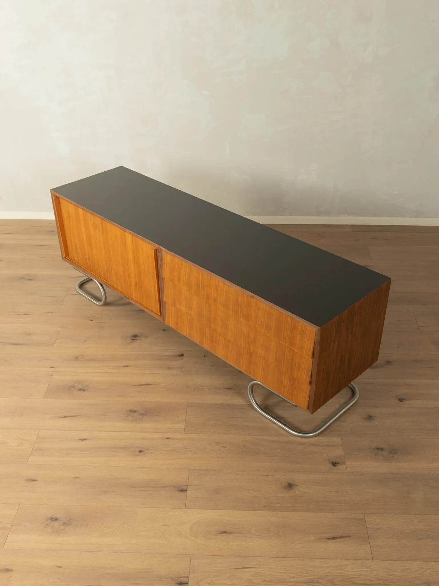 Striking mid-century sideboard with stainless steel base