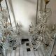 A pair of imposing, antique chandeliers with pendants.