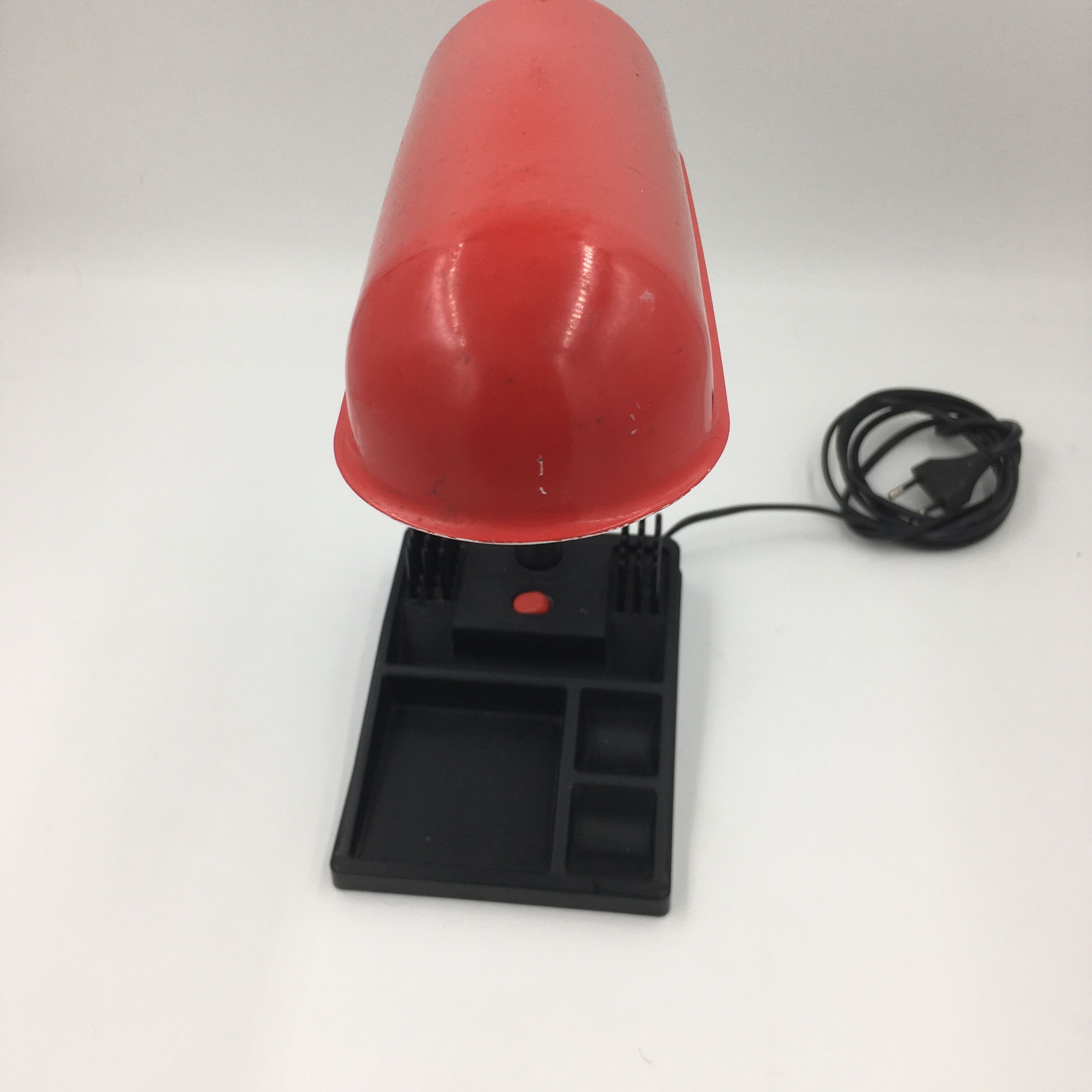 Duo of red and black flexible desk lamps with pencil holder