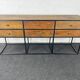 Antique wooden console with black metal base and 6 drawers