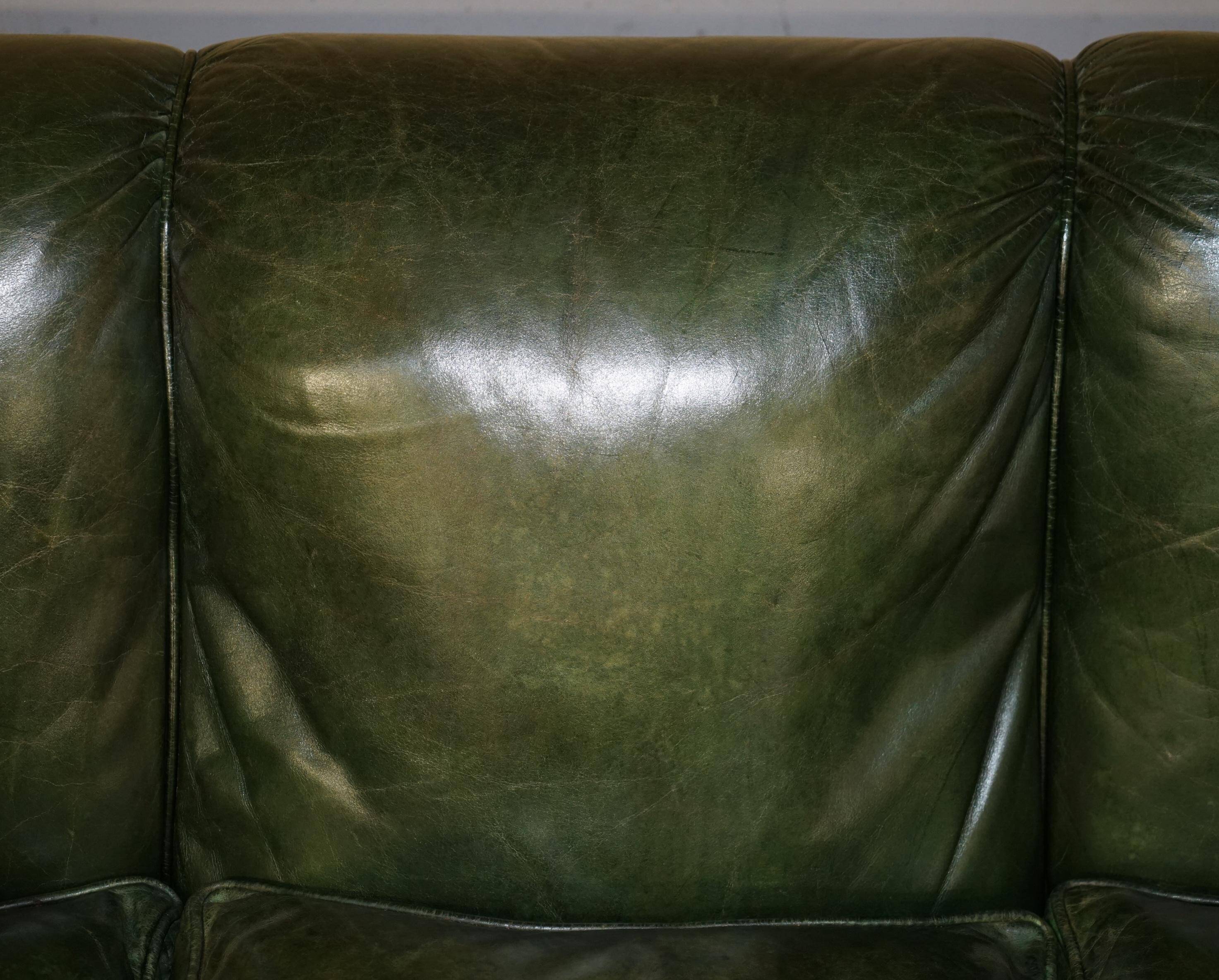 Victorian leather canapé, shield armrests, stamped Maple & Co.