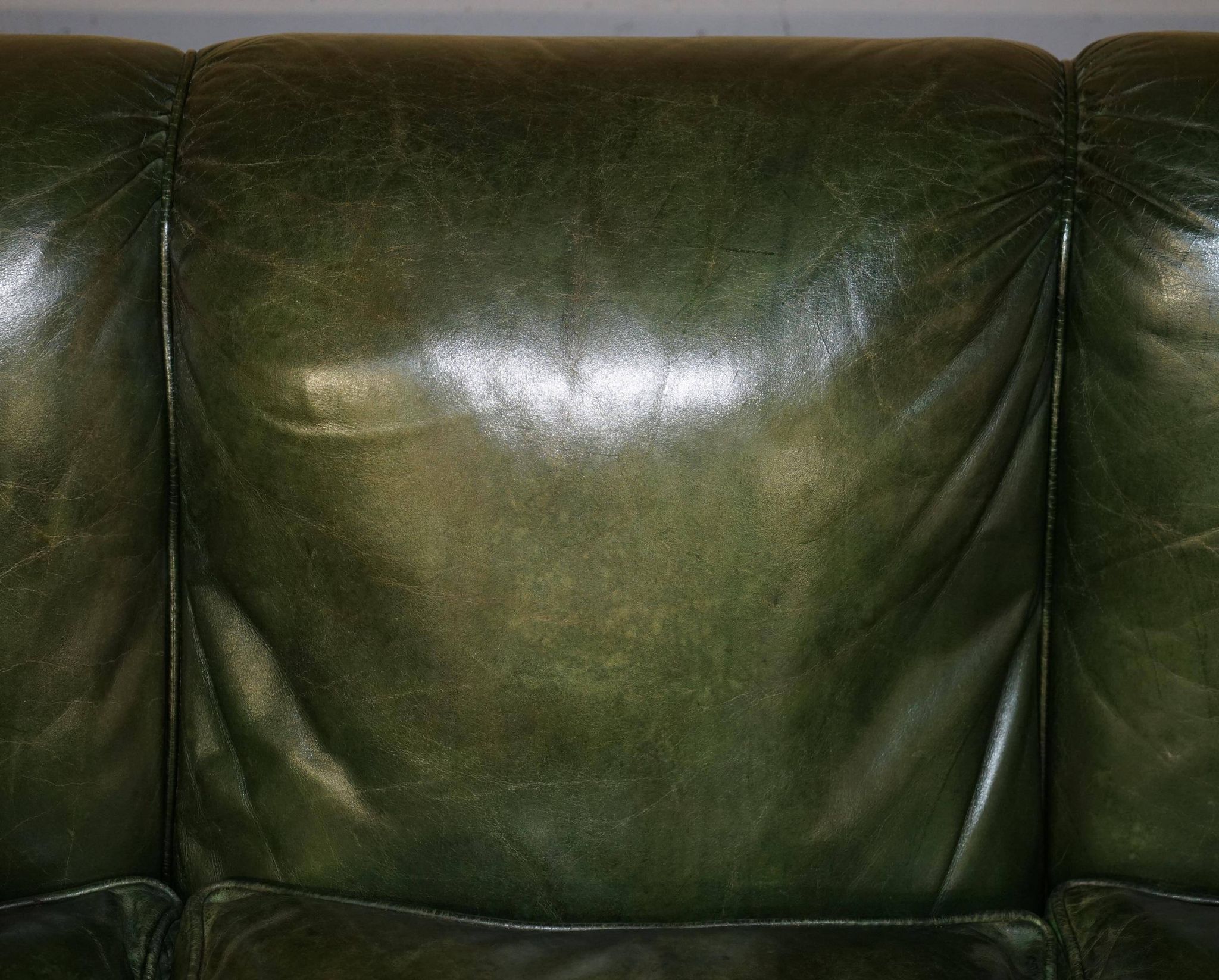 Victorian leather canapé, shield armrests, stamped Maple & Co.