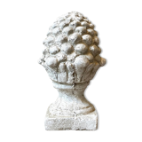 Ornamental pine cone in bleached concrete