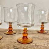 6 small amber stemmed glasses