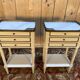 Pair of Louis XVI style bedside tables painted white.