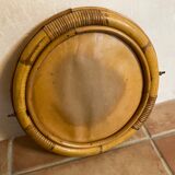 Old rattan mirror with porthole shape