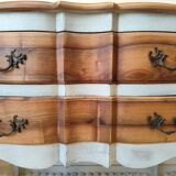 Walnut crossbow chest of drawers