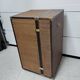 Wardrobe trunk on casters in mahogany and woven rattan.
