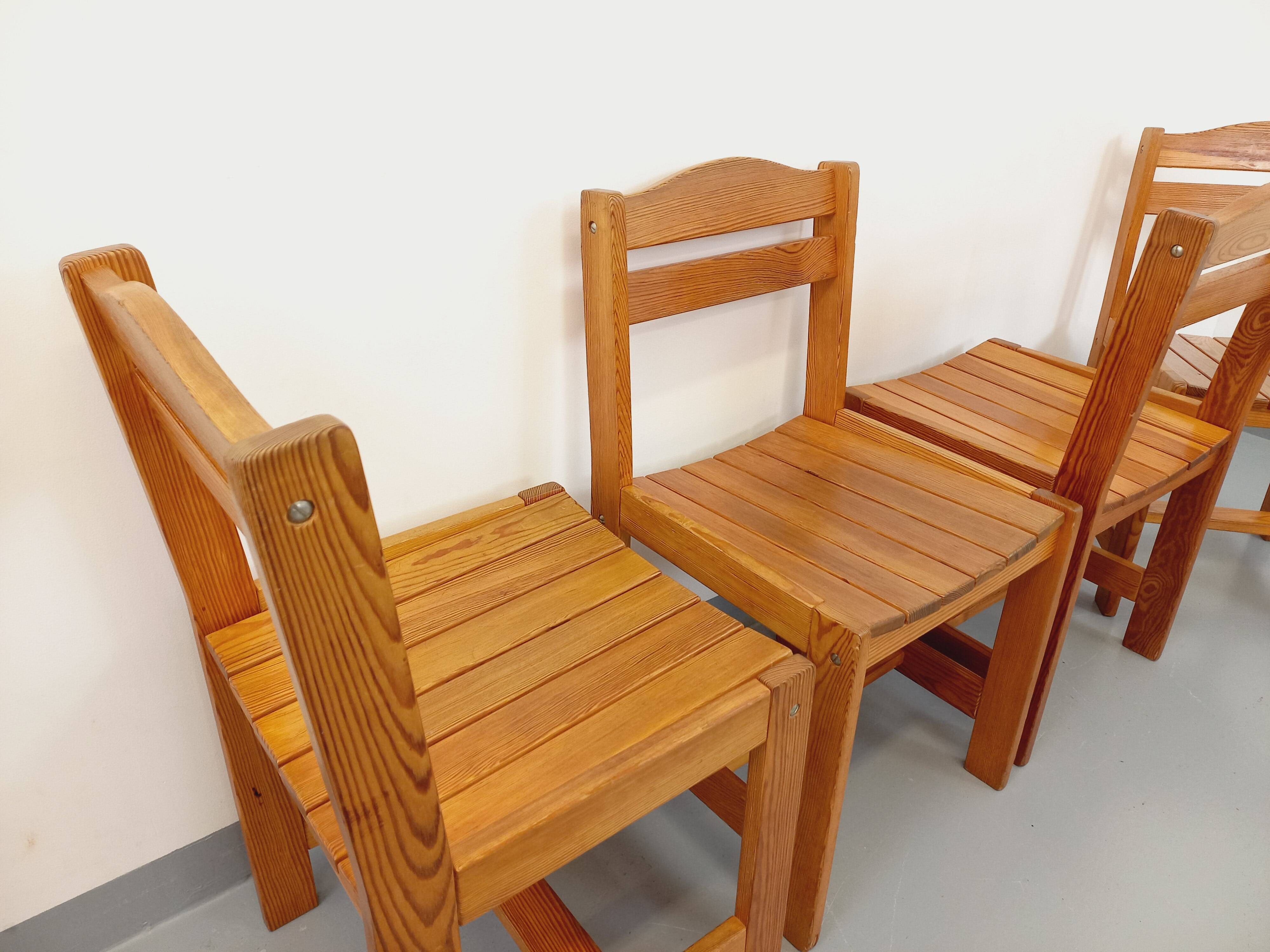 Set of 4 vintage pine chairs from the 70s