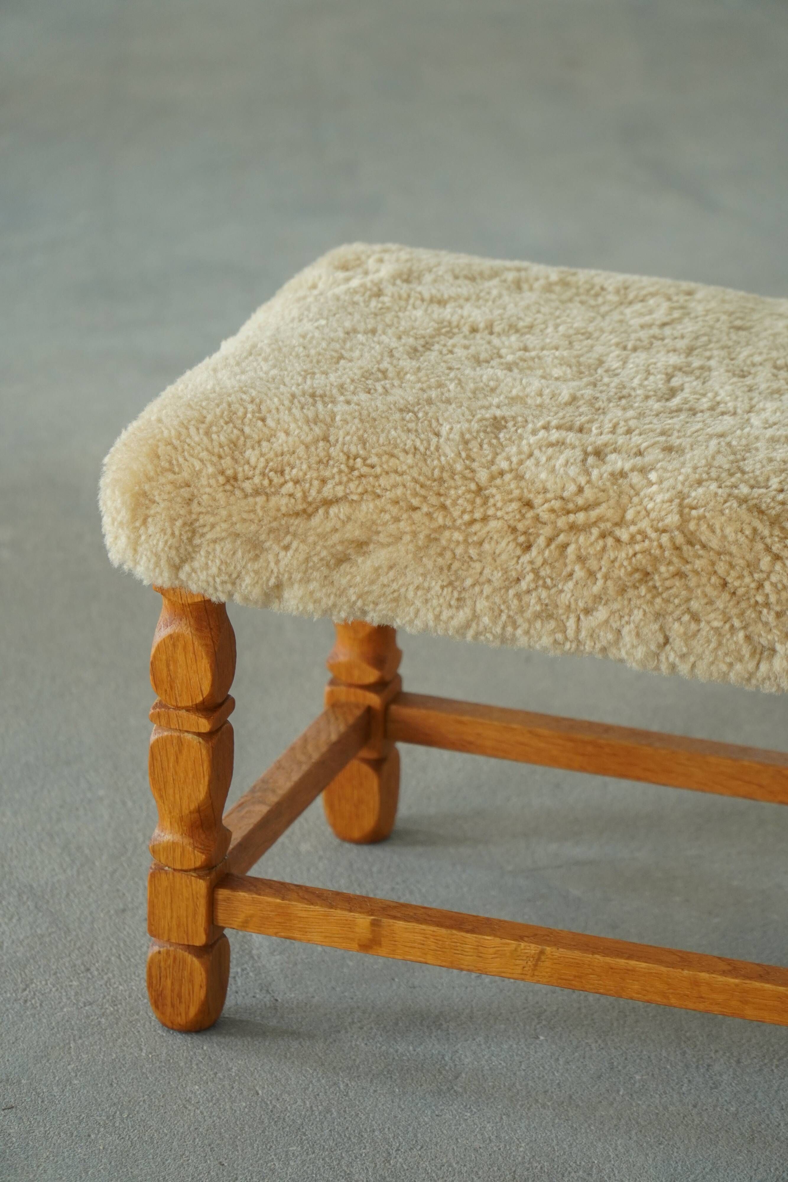 Rectangular oak stool, reupholstered in lambswool, Danish cabinetmaker, 1960.