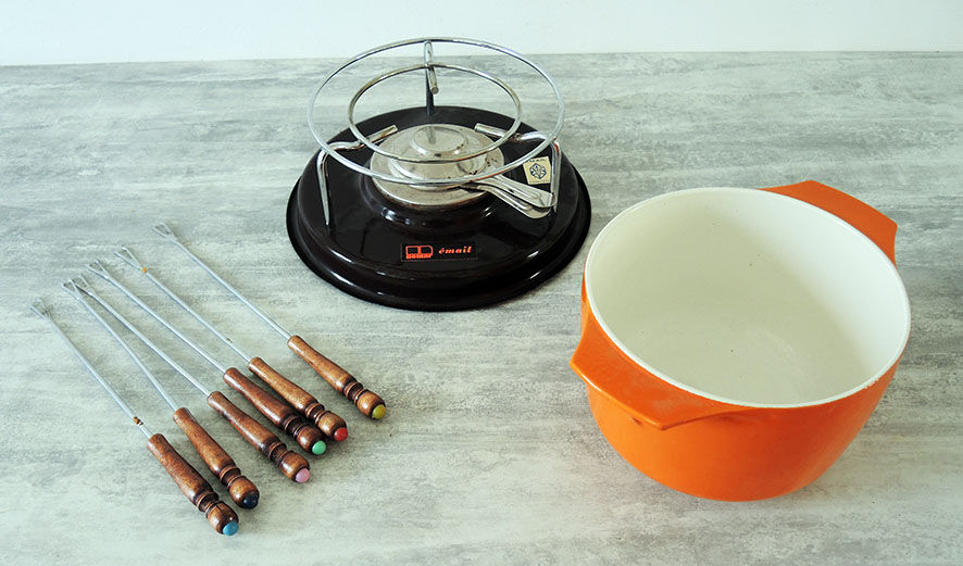 Nomar fondue service in orange cast iron