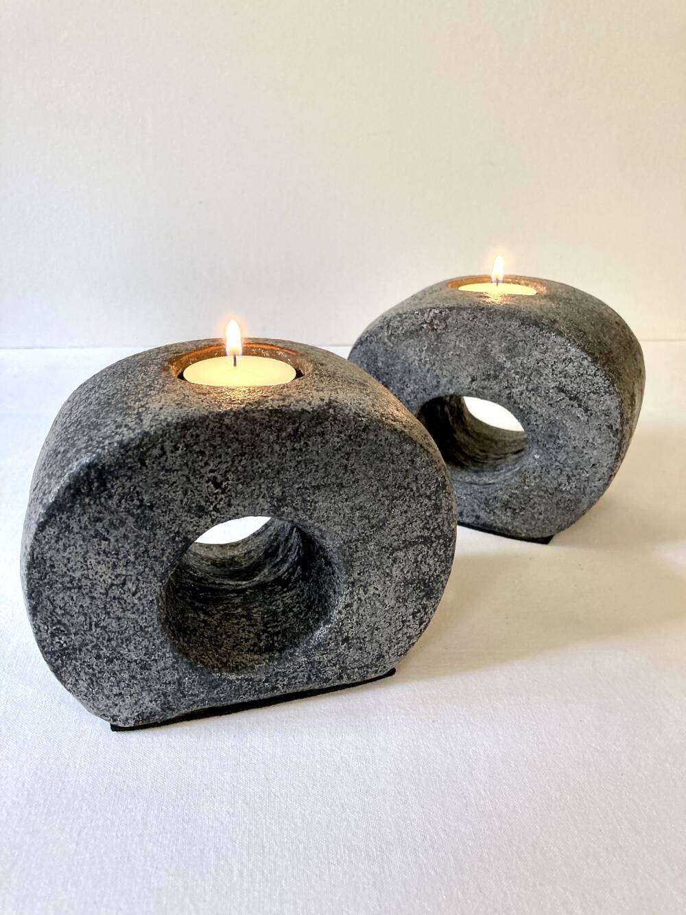 Pair of terracotta candle holders with anthracite finish, 1980s.