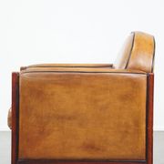 Sheep leather and wooden Art Deco design armchair with ball feet