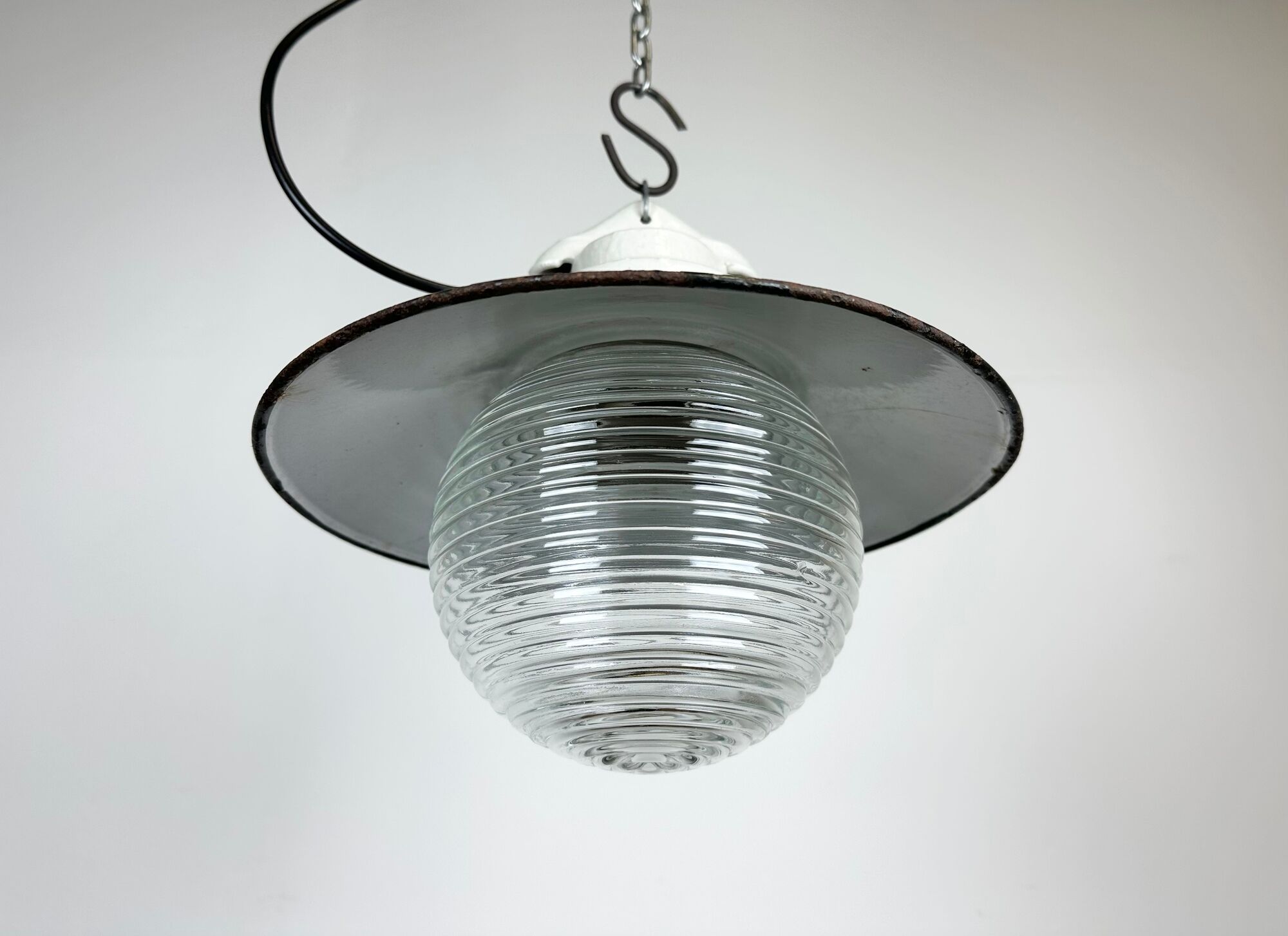 Industrial porcelain red enamel pendant light with ribbed clear glass, 1970s