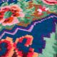 Rug with floral design on a blue background made by hand in Romania