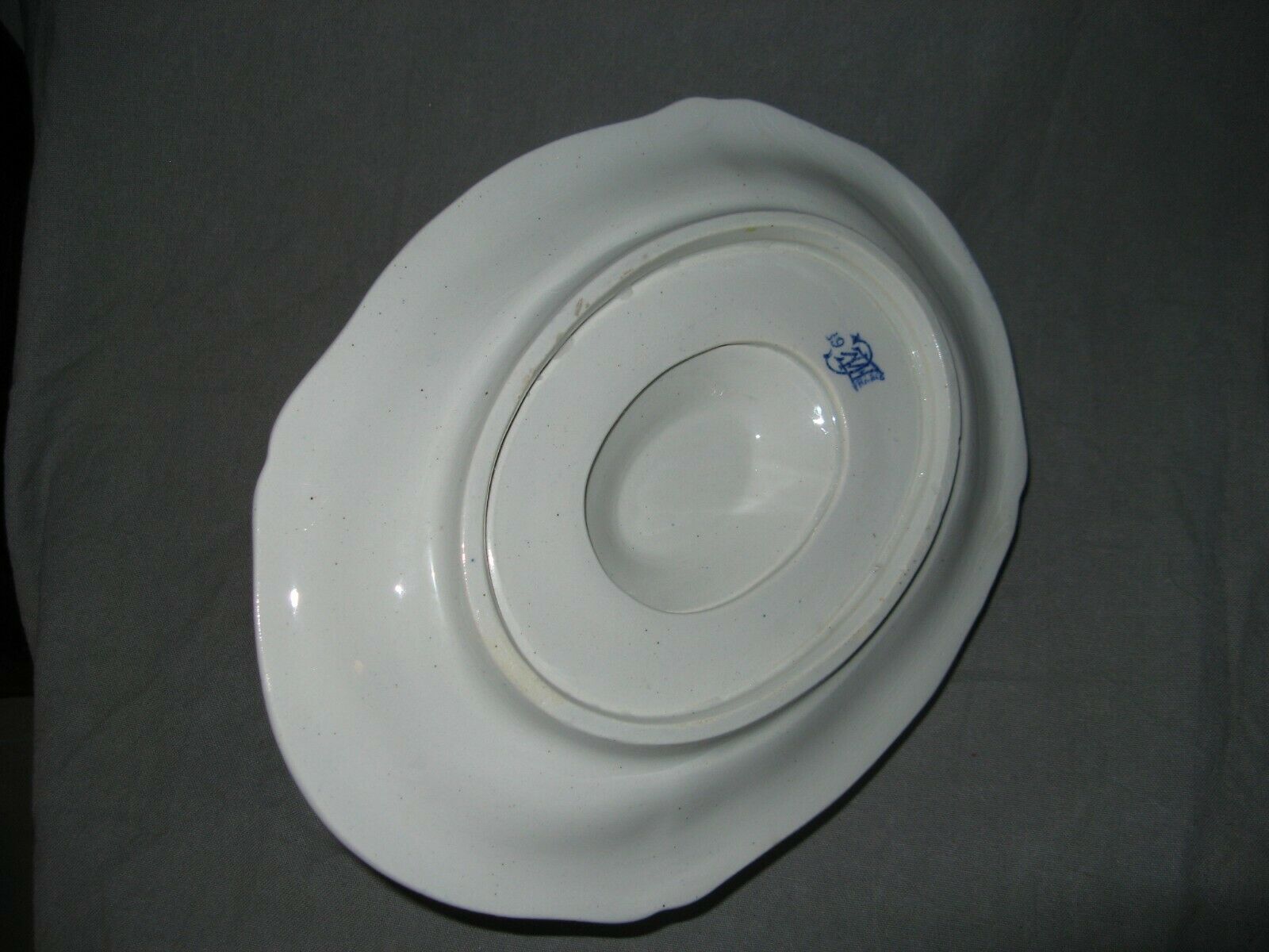 Saucière in Gien earthenware anse in the shape of a dolphin decoration garland 1900