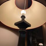 Lamp with red hat and cast iron base