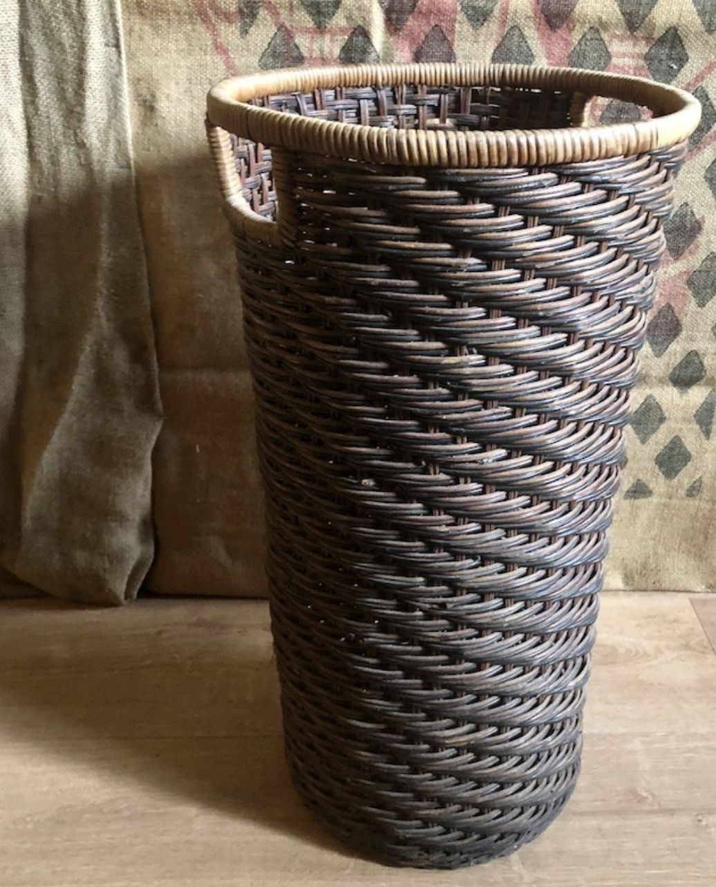 High basket in braided wicker
