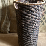 High basket in braided wicker