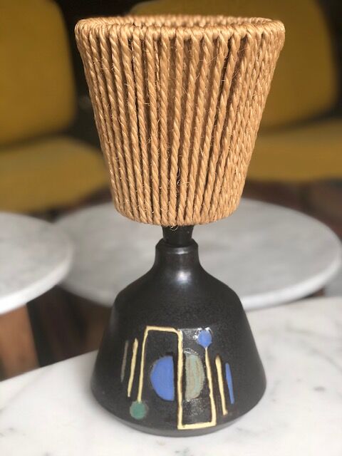 Brutalist style laying lamp with rope lampshade and ceramic foot