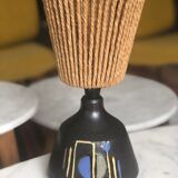 Brutalist style laying lamp with rope lampshade and ceramic foot