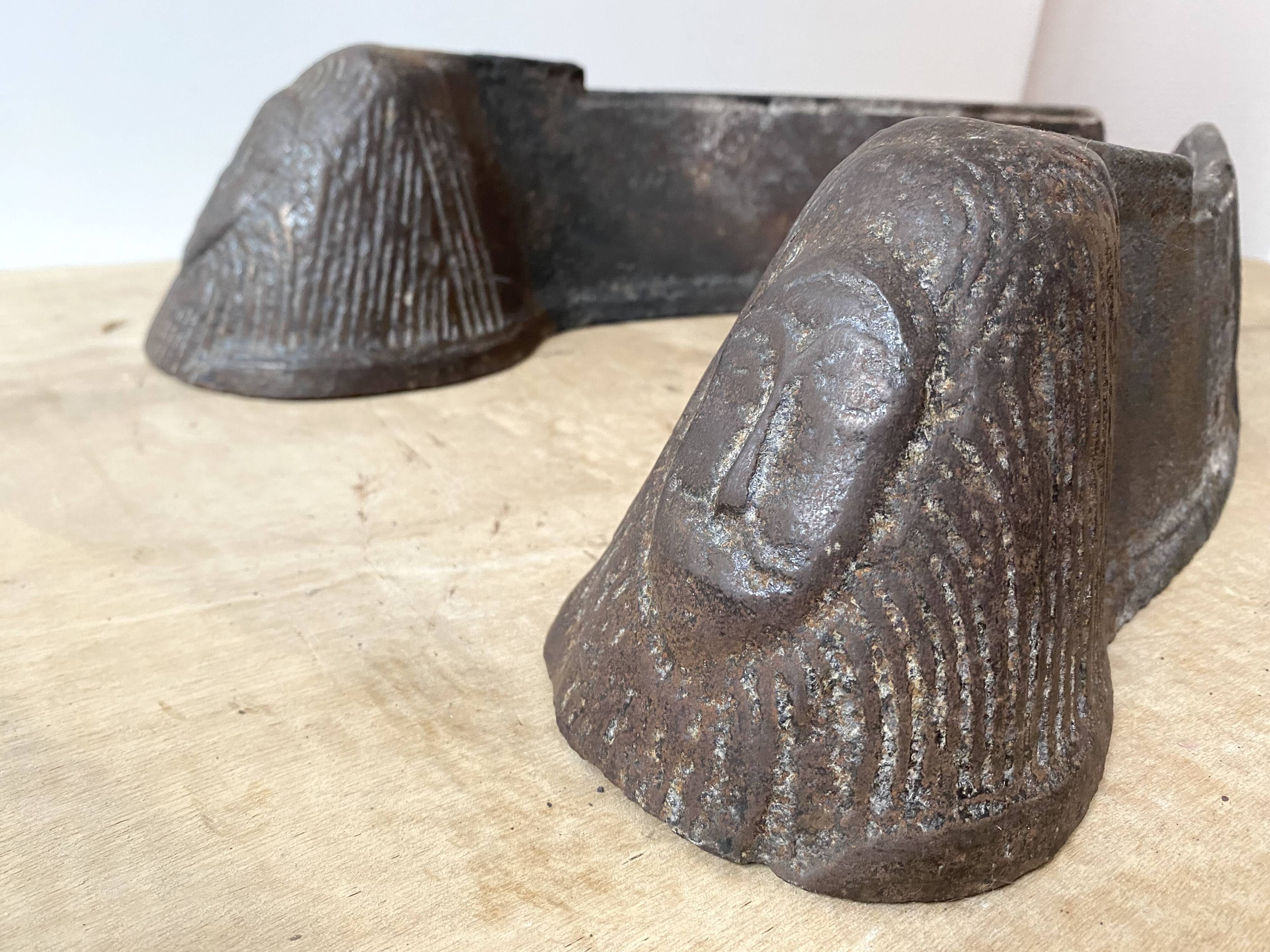 Pair of modernist anthropomorphic fireplace andirons, brutalist log holders 1950s