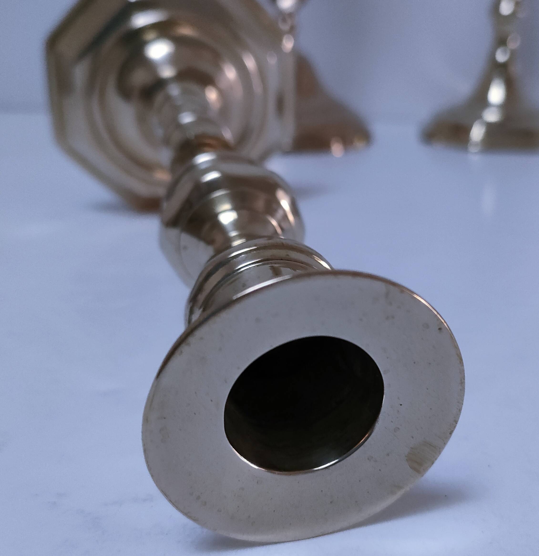 Three vintage solid brass candle holders