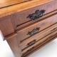 Antique walnut commode with bronze handles in the shape of a lion's mask,