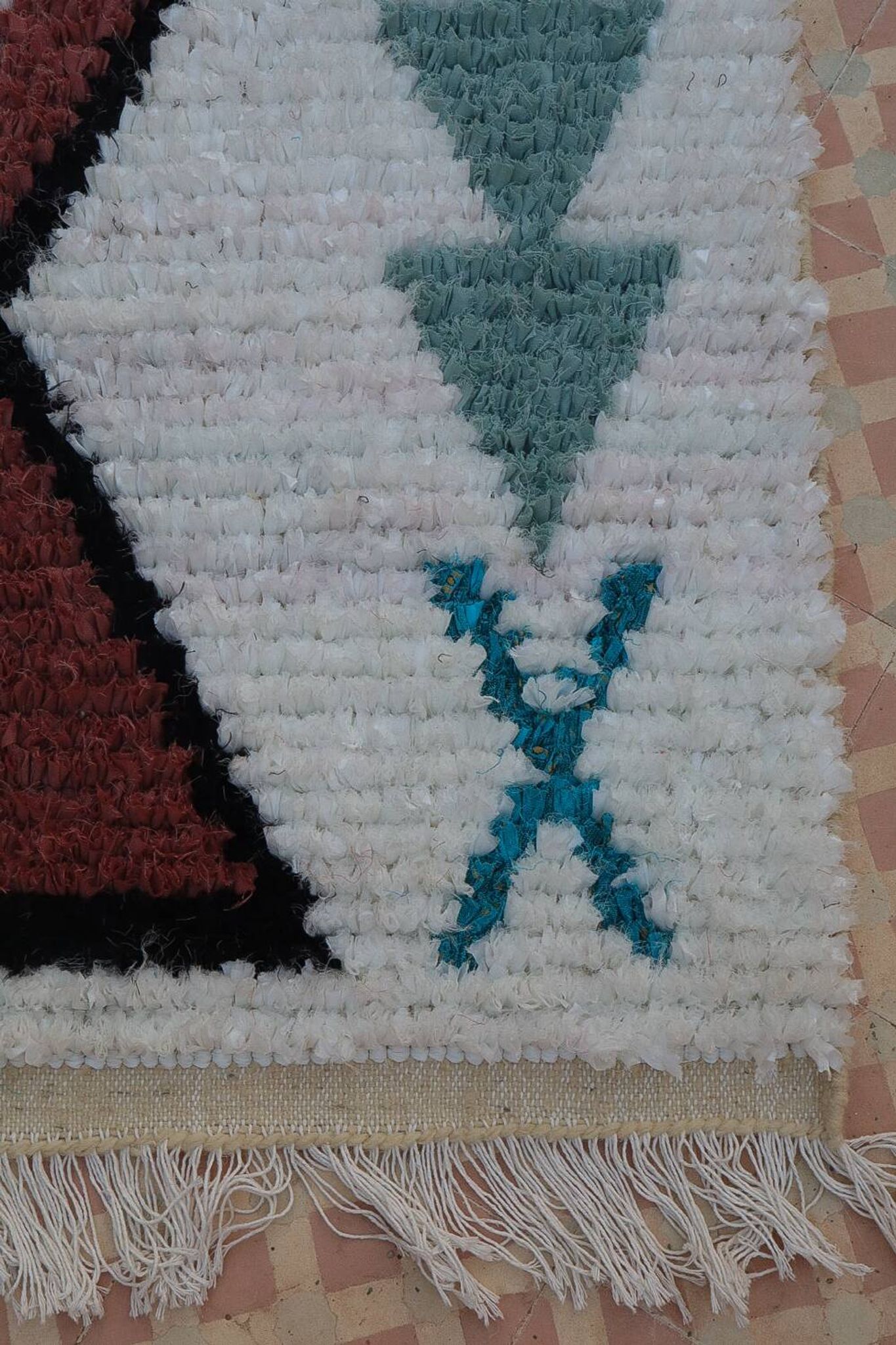 White Moroccan Boucherouite Berber rug with colorful patterns