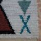 White Moroccan Boucherouite Berber rug with colorful patterns