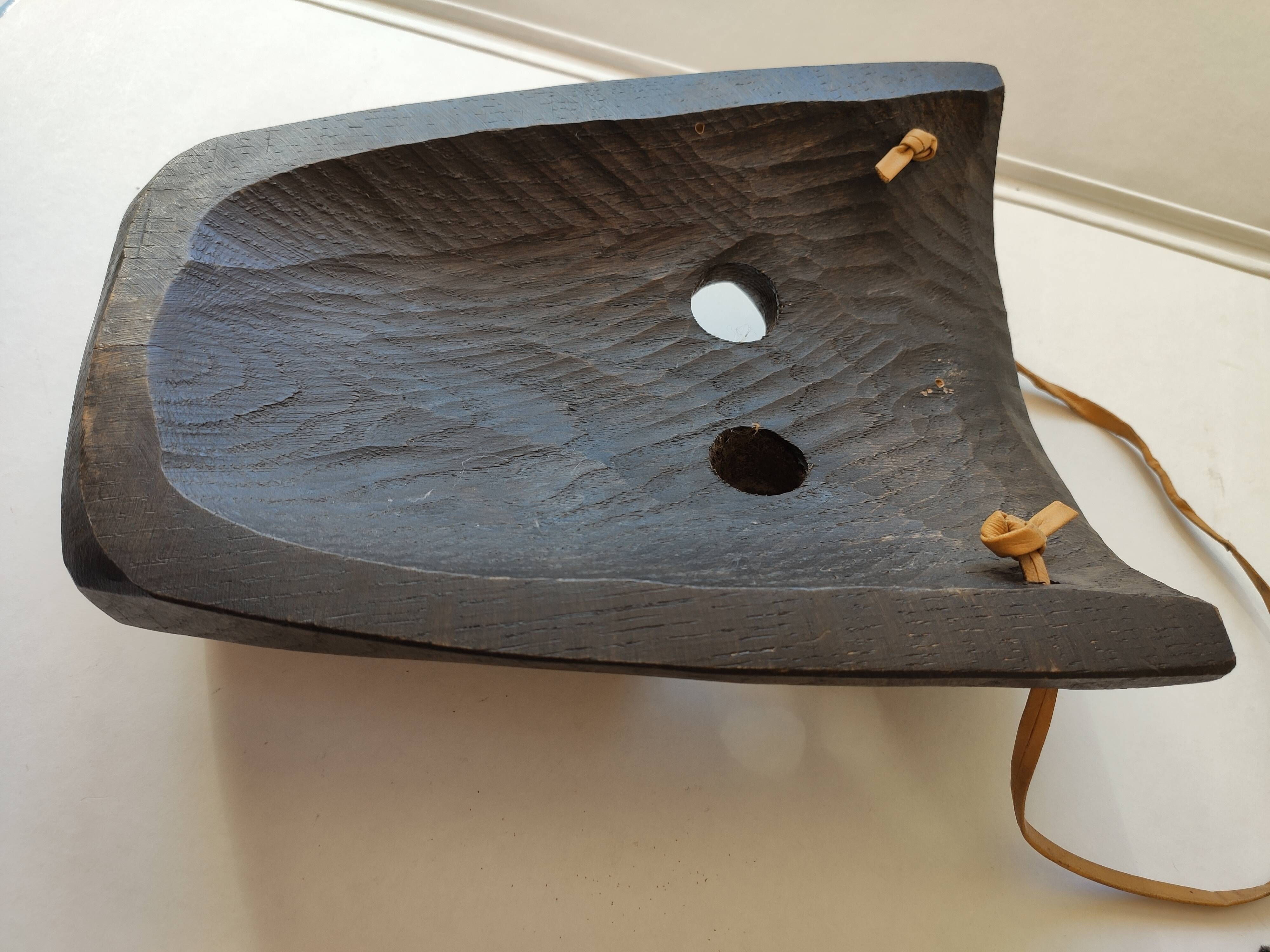 Ethnic ebony wood mask for display or hanging.