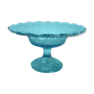 Plate on blue glass pedestal